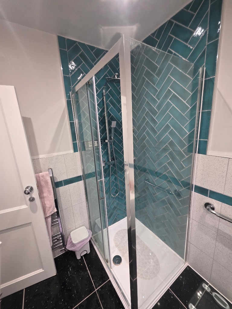 Shower, towel rail and sparkle black flooring